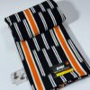 Tissu haut de gamme rayé noir, blanc et orange – Coupon élégant pour tenues modernes